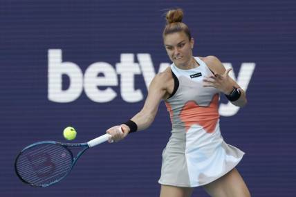 Mar 24, 2023; Miami, Florida, US; Maria Sakkari (GRE) hits a forehand against Bianca Andreescu (CAN) (not pictured) on day five of the Miami Open at Hard Rock Stadium. Mandatory Credit: Geoff Burke-USA TODAY Sports