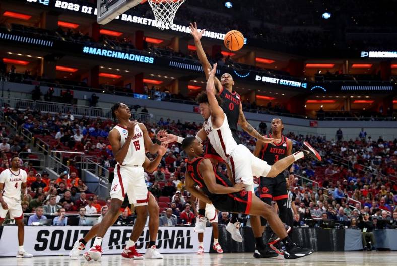 Mar 24, 2023; Louisville, KY, USA; Alabama Crimson Tide guard Mark Sears (1) charges into San Diego State Aztecs guard Lamont Butler (5) during the first half of the NCAA tournament round of sixteen at KFC YUM! Center. Mandatory Credit: Jordan Prather-USA TODAY Sports