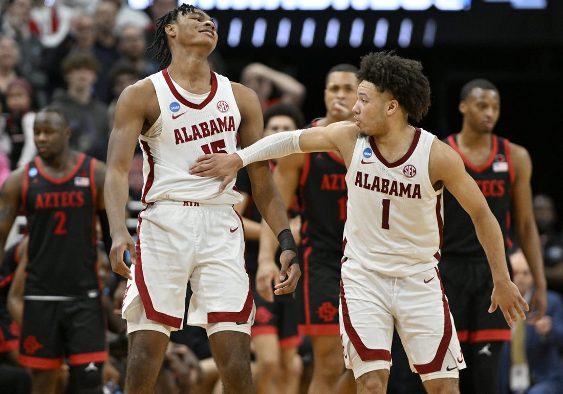 Mar 24, 2023; Louisville, KY, USA; Alabama Crimson Tide forward Noah Clowney (15) and Alabama Crimson Tide guard Mark Sears (1) react after a play during the second half of the NCAA tournament round of sixteen against the San Diego State Aztecs at KFC YUM! Center. Mandatory Credit: Jamie Rhodes-USA TODAY Sports