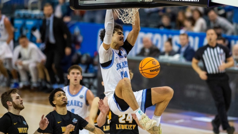 Nova Southeastern's RJ Sunahara (13) dunks the ball as the Nova Southeastern University Sharks play the West Liberty Hilltoppers during the championship game of the 2023 NCAA Division II Men   s basketball tournament at Ford Center in Downtown Evansville, Ind., Saturday afternoon, March 25, 2023.

Mb Ncaadii Championship 02