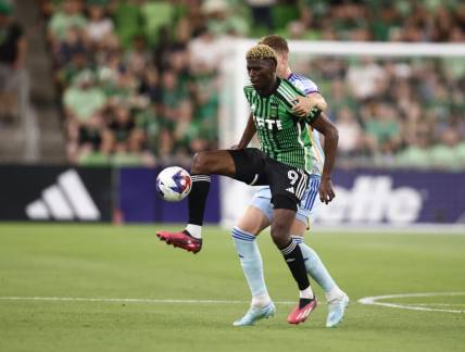Mar 25, 2023; Austin, Texas, USA;  Austin FC forward Gyasi Zardes (9) battles for the ball with Colorado Rapids defender Andreas Maxso (5) in the first half at Q2 Stadium. Mandatory Credit: Erich Schlegel-USA TODAY Sports