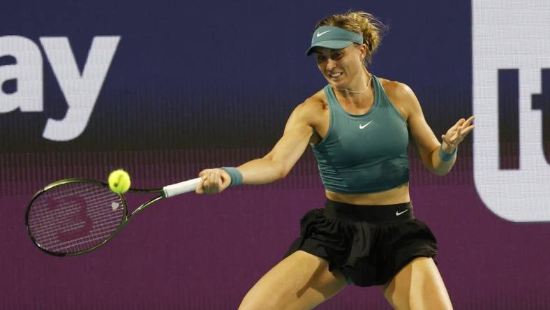 Mar 25, 2023; Miami, Florida, US; Paula Badosa (ESP) hits a forehand against Elena Rybakina (KAZ) (not pictured) on day six of the Miami Open at Hard Rock Stadium. Mandatory Credit: Geoff Burke-USA TODAY Sports