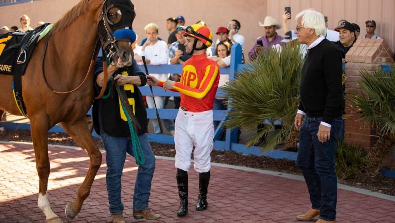 Horse trainer Bob Baffert, right, and jockey Flavien Prat and horse,    Hard to Figure   , #6, moments before racing in the 18th running of the Sunland Derby at Sunland Park Racetrack & Casino in Sunland Park, New Mexico, Sunday, March 26, 2023.