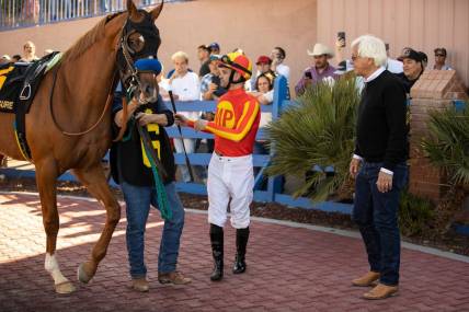 Horse trainer Bob Baffert, right, and jockey Flavien Prat and horse,    Hard to Figure   , #6, moments before racing in the 18th running of the Sunland Derby at Sunland Park Racetrack & Casino in Sunland Park, New Mexico, Sunday, March 26, 2023.
