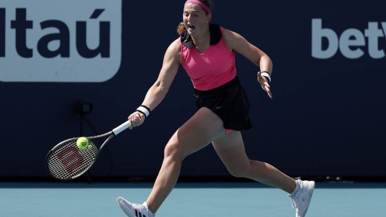 Mar 27, 2023; Miami, Florida, US; Jelena Ostapenko (LAT) hits a forehand against Martina Trevisan (ITA) (not pictured) on day eight of the Miami Open at Hard Rock Stadium. Mandatory Credit: Geoff Burke-USA TODAY Sports