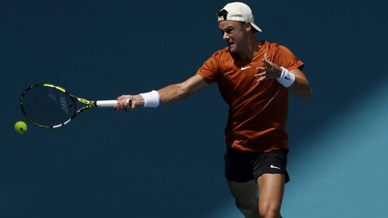 Mar 28, 2023; Miami, Florida, US; Holger Rune (DEN) hits a forehand against Taylor Fritz (USA) (not pictured) on day nine of the Miami Open at Hard Rock  Stadium. Mandatory Credit: Geoff Burke-USA TODAY Sports