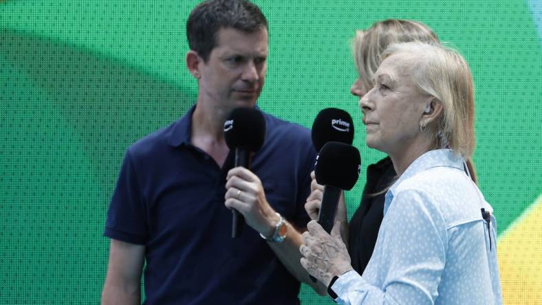 Mar 29, 2023; Miami, Florida, US; Martina Navratilova (R) does a tv hit for PrimeTV with co-presenters Tim Henman (L) and Daniela Hantuchova (M) during a stoppage between sets in the match between Sorana Cirstea (ROU)  and Aryna Sabalenka (both not pictured) in a women's singles quarterfinal on day ten of the Miami Open at Hard Rock Stadium. Mandatory Credit: Geoff Burke-USA TODAY Sports