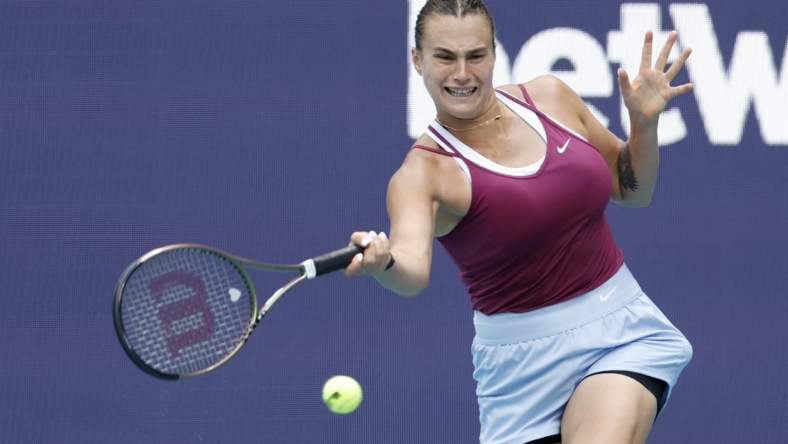 Mar 29, 2023; Miami, Florida, US; Aryna Sabalenka hits a forehand against Sorana Cirstea (ROU) (not pictured) in a women's singles quarterfinal on day ten of the Miami Open at Hard Rock Stadium. Mandatory Credit: Geoff Burke-USA TODAY Sports