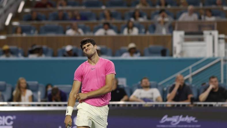 Mar 31, 2023; Miami, Florida, US; Carlos Alcaraz (ESP) reacts after missing a shot against Jannik Sinner (ITA) (not pictured) in a men's singles semifinal on day twelve on the Miami Open at Hard Rock Stadium. Mandatory Credit: Geoff Burke-USA TODAY Sports