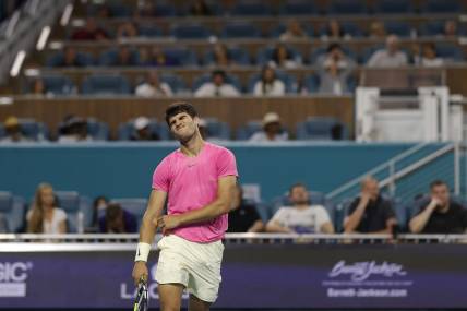 Mar 31, 2023; Miami, Florida, US; Carlos Alcaraz (ESP) reacts after missing a shot against Jannik Sinner (ITA) (not pictured) in a men's singles semifinal on day twelve on the Miami Open at Hard Rock Stadium. Mandatory Credit: Geoff Burke-USA TODAY Sports
