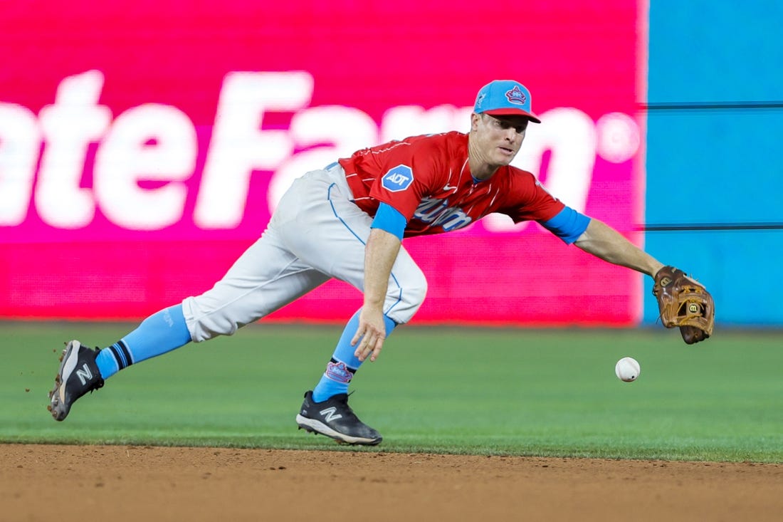 Apr 1, 2023; Miami, Florida, USA; Miami Marlins shortstop Joey Wendle (18) dives but cannot catch a base hit from New York Mets catcher Omar Narvaez (not pictured) during the eighth inning at loanDepot Park. Mandatory Credit: Sam Navarro-USA TODAY Sports