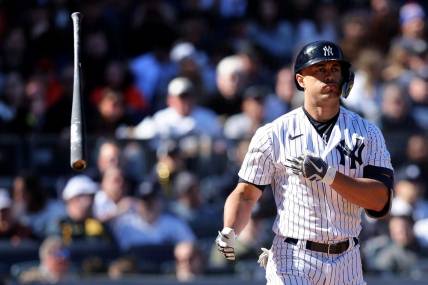 Apr 2, 2023; Bronx, New York, USA; New York Yankees designated hitter Giancarlo Stanton (27) tosses his bat after drawing a walk during the seventh inning against the San Francisco Giants at Yankee Stadium. Mandatory Credit: Brad Penner-USA TODAY Sports