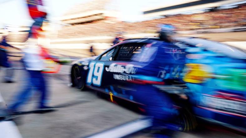 Apr 2, 2023; Richmond, Virginia, USA; NASCAR Cup Series driver Martin Truex Jr. (19) pits during the Toyota Owners 400 at Richmond Raceway. Mandatory Credit: John David Mercer-USA TODAY Sports