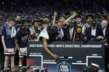 Apr 3, 2023; Houston, TX, USA; Connecticut Huskies players celebrates after defeating the San Diego State Aztecs in the national championship game of the 2023 NCAA Tournament at NRG Stadium. Mandatory Credit: Bob Donnan-USA TODAY Sports