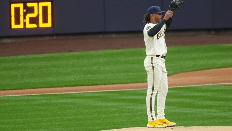 With the pitch timer in the distance, Milwaukee Brewers starting pitcher Freddy Peralta (51) stands on the mound during the first inning of their game against the New York Mets Monday, April 3, 2023 at American Family Field in Milwaukee, Wis.

Brewers03 5