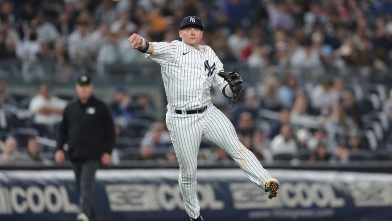 Apr 4, 2023; Bronx, New York, USA; New York Yankees third baseman Josh Donaldson (28) throws the ball to first base for an out during the eighth inning against the Philadelphia Phillies at Yankee Stadium. Mandatory Credit: Vincent Carchietta-USA TODAY Sports