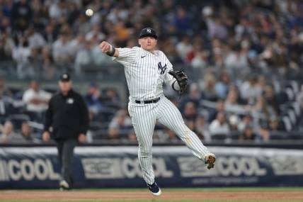 Apr 4, 2023; Bronx, New York, USA; New York Yankees third baseman Josh Donaldson (28) throws the ball to first base for an out during the eighth inning against the Philadelphia Phillies at Yankee Stadium. Mandatory Credit: Vincent Carchietta-USA TODAY Sports