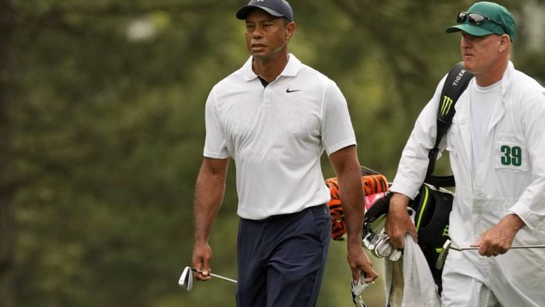 Apr 6, 2023; Augusta, Georgia, USA; Tiger Woods walks on the first fairway with caddie Joe LaCava during the first round of The Masters golf tournament. Mandatory Credit: Michael Madrid-USA TODAY Network

Pga Masters Tournament First Round