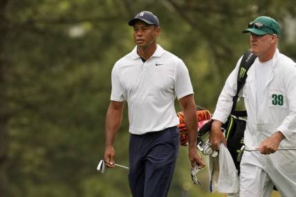 Apr 6, 2023; Augusta, Georgia, USA; Tiger Woods walks on the first fairway with caddie Joe LaCava during the first round of The Masters golf tournament. Mandatory Credit: Michael Madrid-USA TODAY Network

Pga Masters Tournament First Round