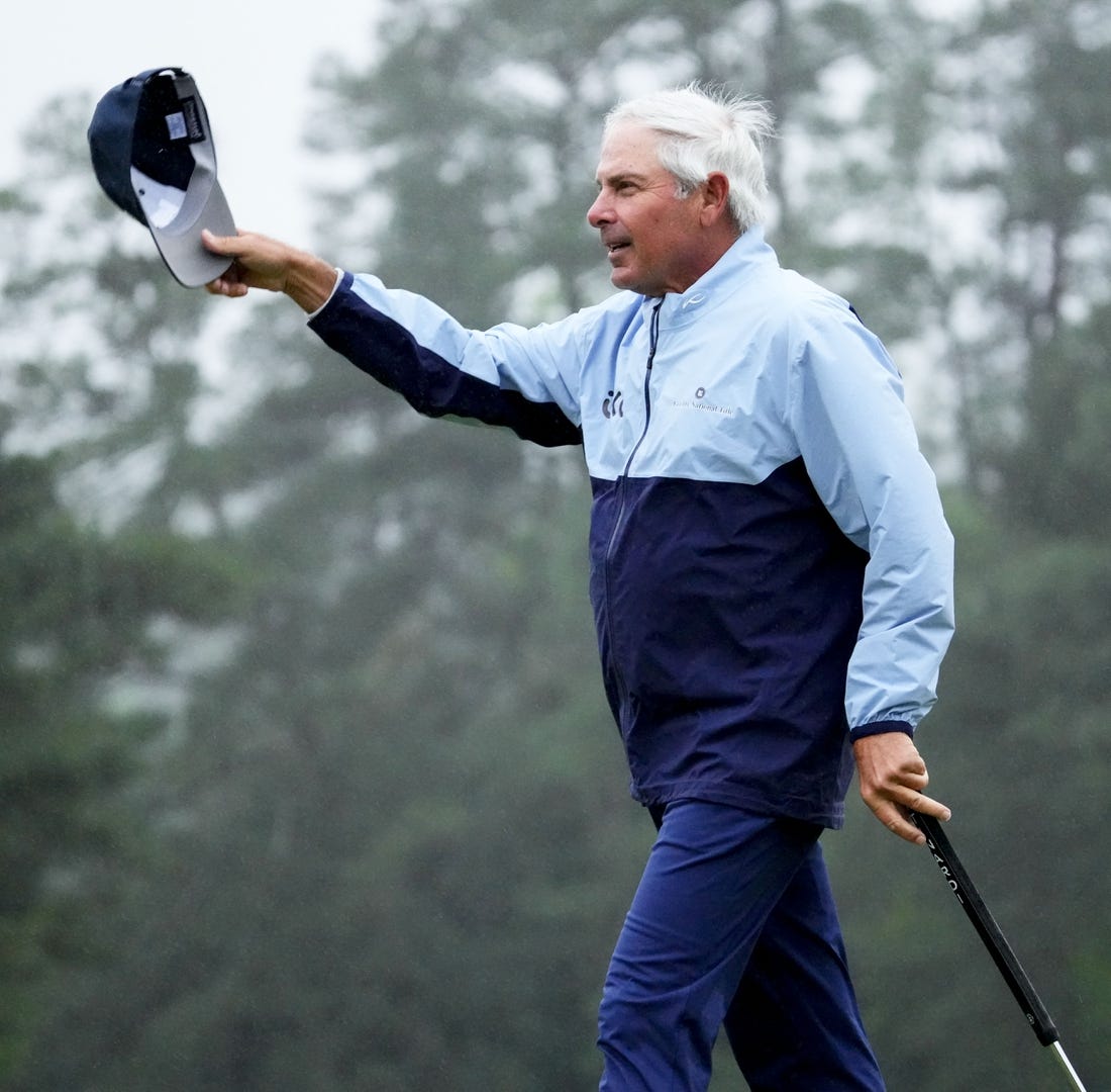 Apr 8, 2023; Augusta, Georgia, USA; Fred Couples waves to patrons from the 18th green during the second round of The Masters golf tournament. Mandatory Credit: Rob Schumacher-USA TODAY Network