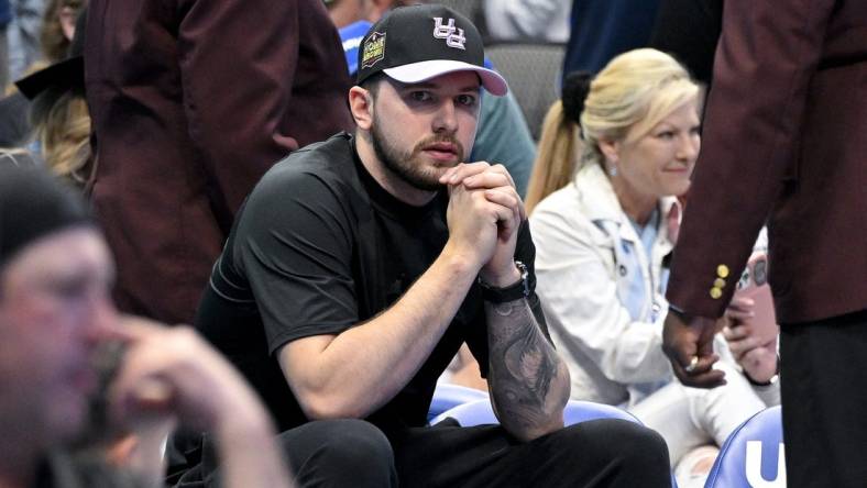 Apr 9, 2023; Dallas, Texas, USA; Dallas Mavericks guard Luka Doncic (77) sits by himself during a timeout in the game between the Dallas Mavericks and the San Antonio Spurs at the American Airlines Center. Mandatory Credit: Jerome Miron-USA TODAY Sports