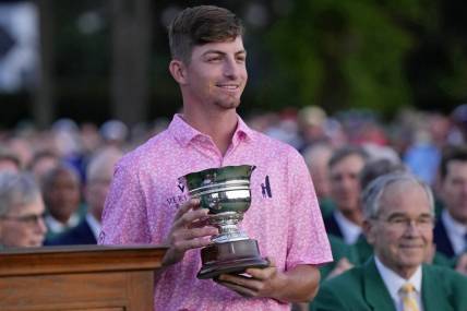 Apr 9, 2023; Augusta, Georgia, USA; Sam Bennett holds the low amateur trophy after the final round of The Masters golf tournament. Mandatory Credit: Michael Madrid-USA TODAY Network