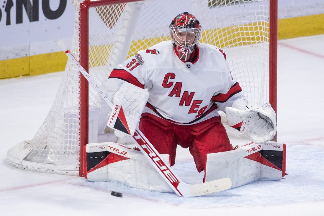 Apr 10, 2023; Ottawa, Ontario, CAN; Carolina Hurricanes goalie Frederik Andersen (31) makes a save in the third period against the Ottawa Senators at the Canadian Tire Centre. Mandatory Credit: Marc DesRosiers-USA TODAY Sports