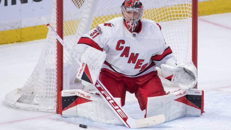 Apr 10, 2023; Ottawa, Ontario, CAN; Carolina Hurricanes goalie Frederik Andersen (31) makes a save in the third period against the Ottawa Senators at the Canadian Tire Centre. Mandatory Credit: Marc DesRosiers-USA TODAY Sports