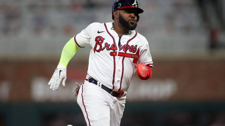 Apr 11, 2023; Atlanta, Georgia, USA; Atlanta Braves designated hitter Marcell Ozuna (20) runs to third against the Cincinnati Reds in the fourth inning at Truist Park. Mandatory Credit: Brett Davis-USA TODAY Sports