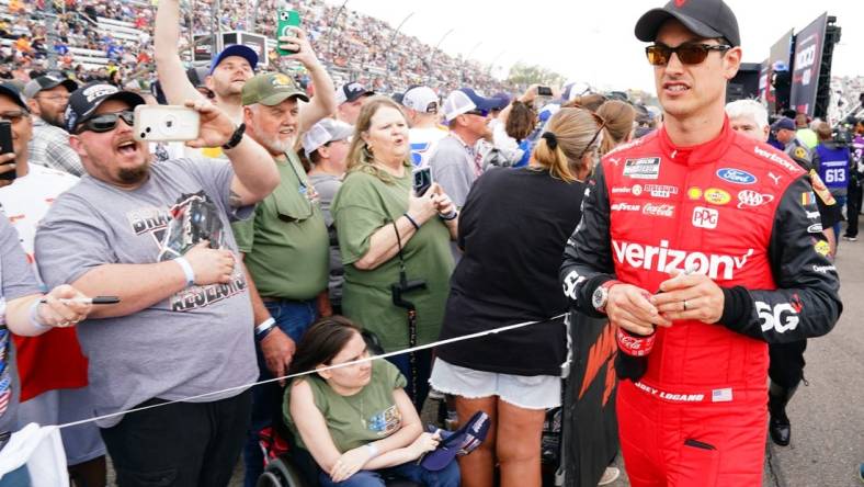 Apr 16, 2023; Martinsville, Virginia, USA; NASCAR Cup Series driver Joey Logano (22) greets fans during prerace festivities before the NOCO 400 at Martinsville Speedway. Mandatory Credit: John David Mercer-USA TODAY Sports