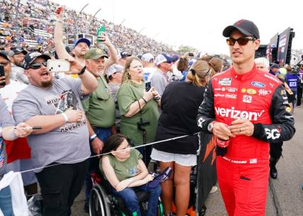 Apr 16, 2023; Martinsville, Virginia, USA; NASCAR Cup Series driver Joey Logano (22) greets fans during prerace festivities before the NOCO 400 at Martinsville Speedway. Mandatory Credit: John David Mercer-USA TODAY Sports