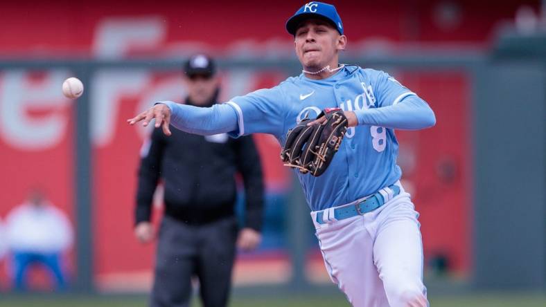 Apr 16, 2023; Kansas City, Missouri, USA; Kansas City Royals shortstop Nicky Lopez (8) throws to first base during the sixth inning against the Atlanta Braves at Kauffman Stadium. Mandatory Credit: William Purnell-USA TODAY Sports