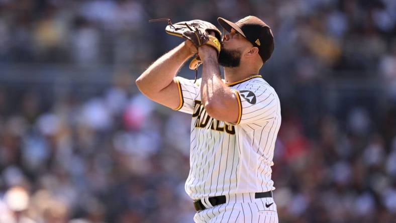 Apr 19, 2023; San Diego, California, USA; San Diego Padres relief pitcher Luis Garcia (66) walks to the dugout after being replaced during the eighth inning against the Atlanta Braves at Petco Park. Mandatory Credit: Orlando Ramirez-USA TODAY Sports