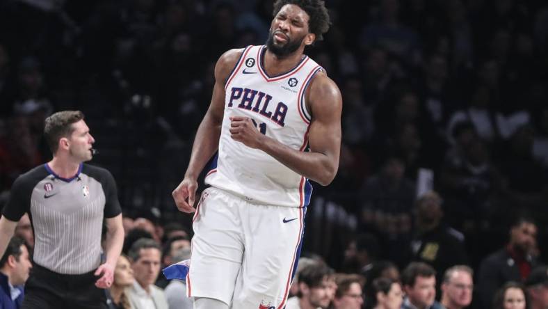 Apr 20, 2023; Brooklyn, New York, USA; Philadelphia 76ers center Joel Embiid (21) grimaces during game three of the 2023 NBA playoffs against the Brooklyn Nets at Barclays Center. Mandatory Credit: Wendell Cruz-USA TODAY Sports