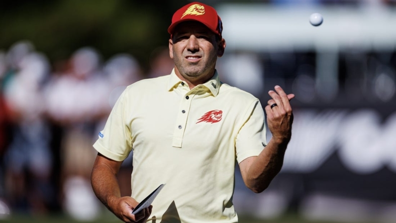 Apr 21, 2023; Adelaide, South Australia AUS; Sergio Garcia of team Fireballs throw a ball to the crowd during the first round of LIV Golf Adelaide golf tournament at Grange Golf Club. Mandatory Credit: Mike Frey-USA TODAY Sports
