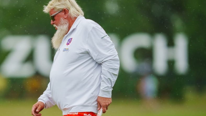 Apr 21, 2023; Avondale, Louisiana, USA; John Daly walks the 18th green during the second round of the Zurich Classic of New Orleans golf tournament. Mandatory Credit: Andrew Wevers-USA TODAY Sports