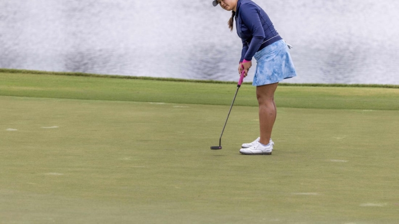 Apr 21, 2023; The Woodlands, Texas, USA;  Lilia Vu (USA) sinks a putt on the ninth green during the second round of The Chevron Championship golf tournament. Mandatory Credit: Thomas Shea-USA TODAY Sports