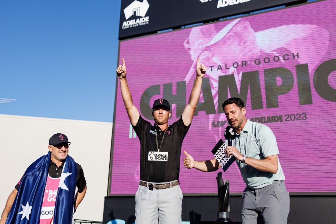 Apr 23, 2023; Adelaide, South Australia, AUS; Talor Gooch celebrates his victory in the individual tournament after the final round of LIV Golf Adelaide golf tournament at Grange Golf Club. Mandatory Credit: Mike Frey-USA TODAY Sports