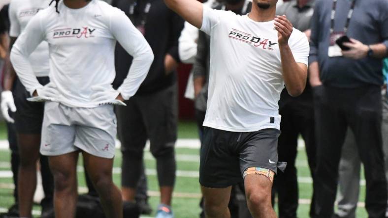 Bryce Young throws during Alabama's pro day. Carolina Panthers head coach Frank Reich and his assistants look on.

Syndication Tuscaloosa News