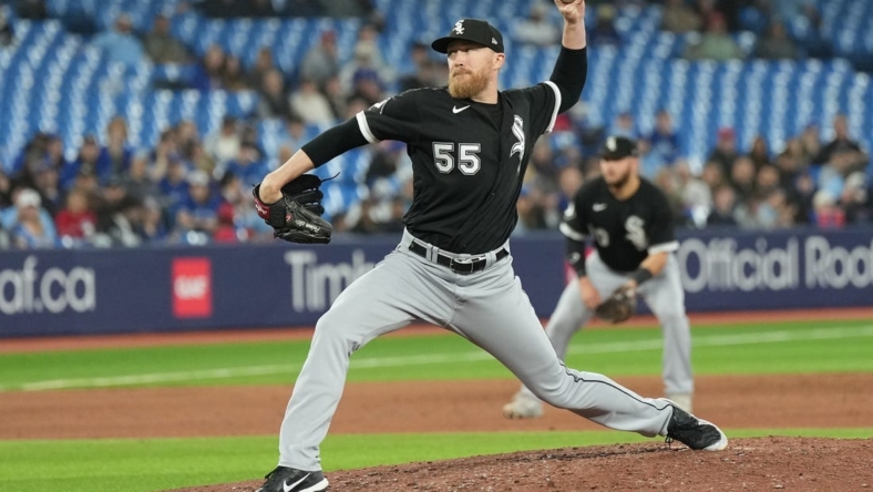 Apr 24, 2023; Toronto, Ontario, CAN; Chicago White Sox relief pitcher Jake Diekman (55) throws a pitch against the Toronto Blue Jays during the seventh inning at Rogers Centre. Mandatory Credit: Nick Turchiaro-USA TODAY Sports