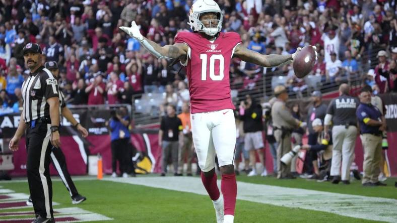 Arizona Cardinals wide receiver DeAndre Hopkins (10) celebrates after a touchdown catch against the Los Angeles Chargers during the first quarter at State Farm Stadium in Glendale on Nov. 27, 2022.

Syndication Arizona Republic