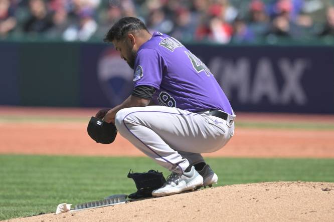 Apr 26, 2023; Cleveland, Ohio, USA; Colorado Rockies starting pitcher German Marquez (48) crouches on the mound before leaving the game during the fourth inning against the Cleveland Guardians at Progressive Field. Mandatory Credit: Ken Blaze-USA TODAY Sports