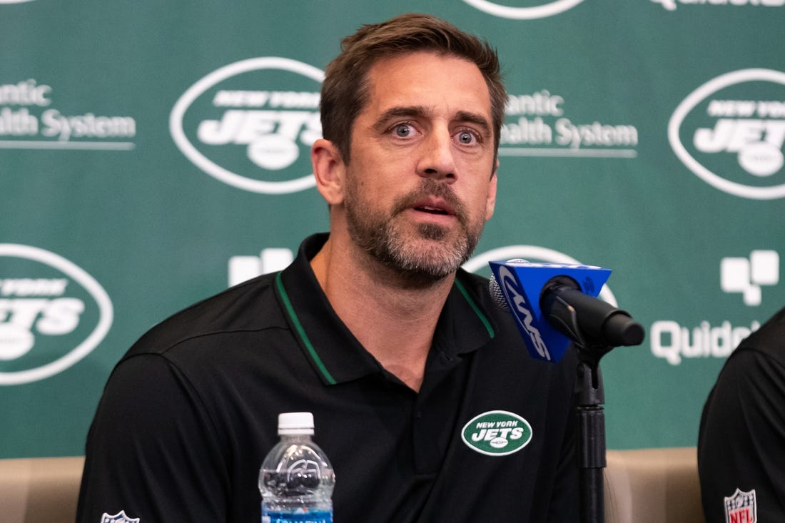 Apr 26, 2023; Florham Park, NJ, USA; New York Jets quarterback Aaron Rodgers (8) answers questions during the introductory press conference at Atlantic Health Jets Training Center. Mandatory Credit: Tom Horak-USA TODAY Sports