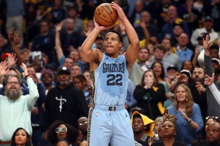 Apr 26, 2023; Memphis, Tennessee, USA; Memphis Grizzlies guard Desmond Bane (22) shoots a three point shot during the second half against the Los Angeles Lakers during game five of the 2023 NBA playoffs at FedExForum. Mandatory Credit: Petre Thomas-USA TODAY Sports