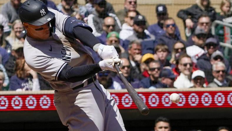 Apr 26, 2023; Minneapolis, Minnesota, USA; New York Yankees designated hitter Aaron Judge (99) hits a single against the Minnesota Twins during the fifth inning at Target Field. Mandatory Credit: Nick Wosika-USA TODAY Sports