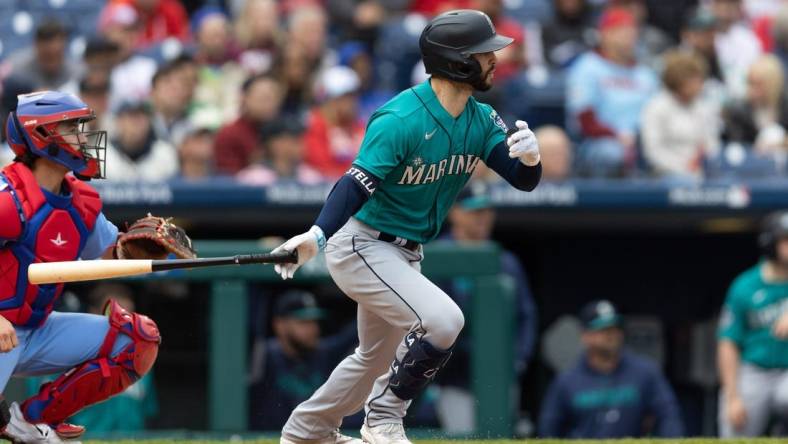 Apr 27, 2023; Philadelphia, Pennsylvania, USA; Seattle Mariners third baseman Tommy La Stella (4) hits a single during the seventh inning against the Philadelphia Phillies at Citizens Bank Park. Mandatory Credit: Bill Streicher-USA TODAY Sports