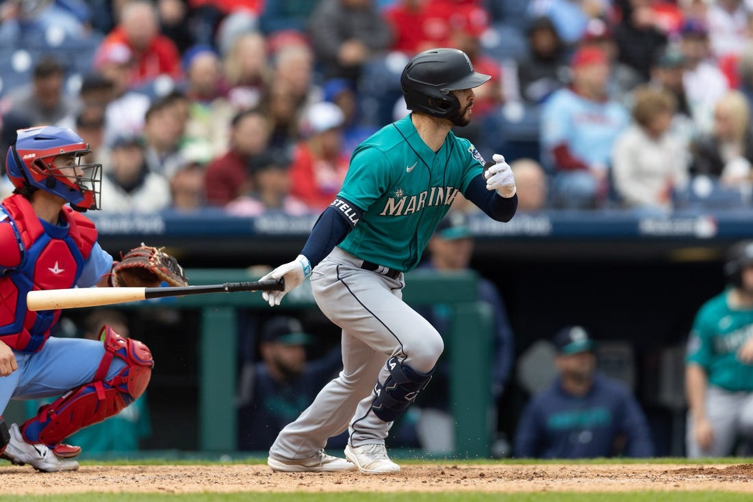 Apr 27, 2023; Philadelphia, Pennsylvania, USA; Seattle Mariners third baseman Tommy La Stella (4) hits a single during the seventh inning against the Philadelphia Phillies at Citizens Bank Park. Mandatory Credit: Bill Streicher-USA TODAY Sports