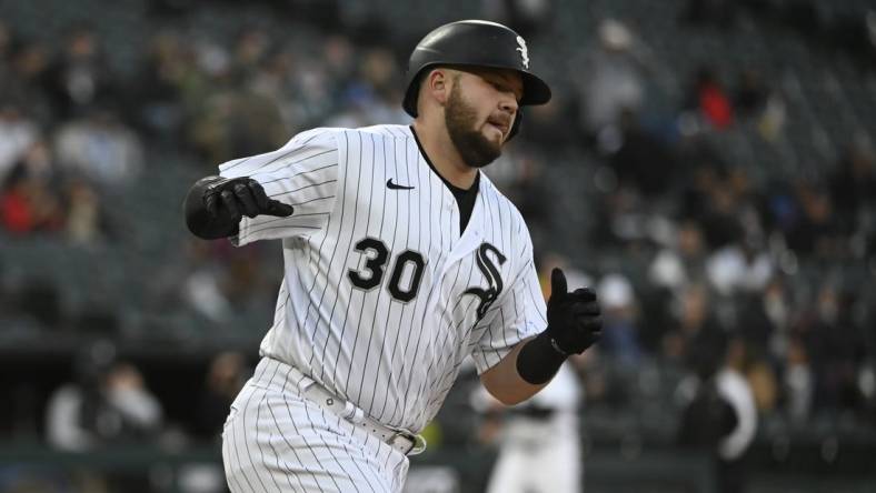 Apr 27, 2023; Chicago, Illinois, USA; Chicago White Sox third baseman Jake Burger (30) reacts after hitting a home run against the Tampa Bay Rays during the fourth inning at Guaranteed Rate Field. Mandatory Credit: Matt Marton-USA TODAY Sports