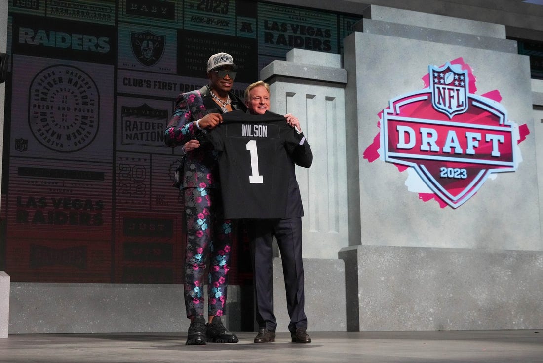 Apr 27, 2023; Kansas City, MO, USA;  Texas Tech defensive end Tyree Wilson with NFL commissioner Roger Goodell after being selected by the Las Vegas Raiders seventh overall in the first round of the 2023 NFL Draft at Union Station. Mandatory Credit: Kirby Lee-USA TODAY Sports