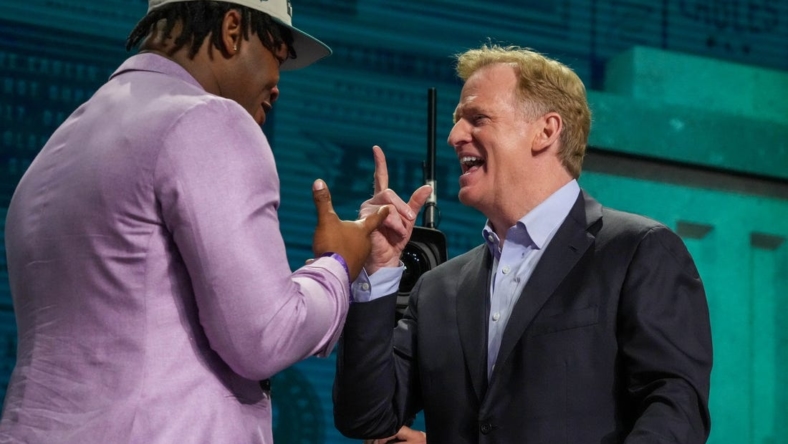 Apr 27, 2023; Kansas City, MO, USA; Georgia defensive lineman Jalen Carter reacts with NFL commissioner Roger Goodell after being selected by the Philadelphia Eagles ninth overall in the first round of the 2023 NFL Draft at Union Station. Mandatory Credit: Kirby Lee-USA TODAY Sports